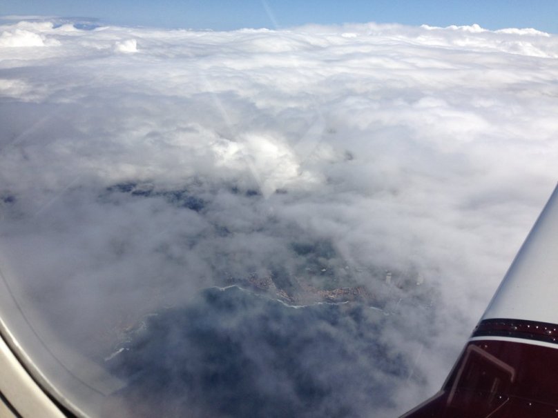 The north coast of Tenerife can be seen through the clouds